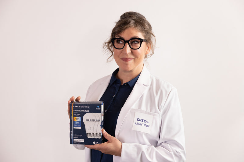 Mayim Bialik in cree lighting lab holding a package of Cree lighting products 